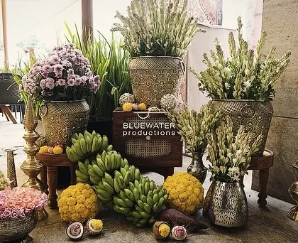 Another angle of the traditional welcome decor, showcasing the abundance of fresh flowers and fruits.