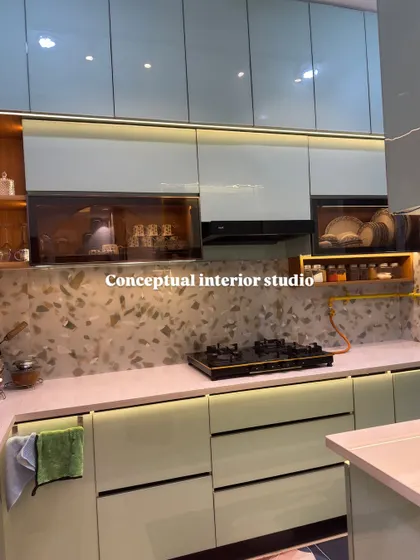 This view highlights the combination of open and closed storage. The wooden open shelves add warmth and a display area, contrasting beautifully with the sleek, modern cabinets.