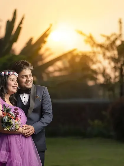 An expecting couple is captured against a beautiful sunset backdrop during their outdoor maternity shoot. I create romantic and scenic pregnancy portraits in locations around Kolhapur.