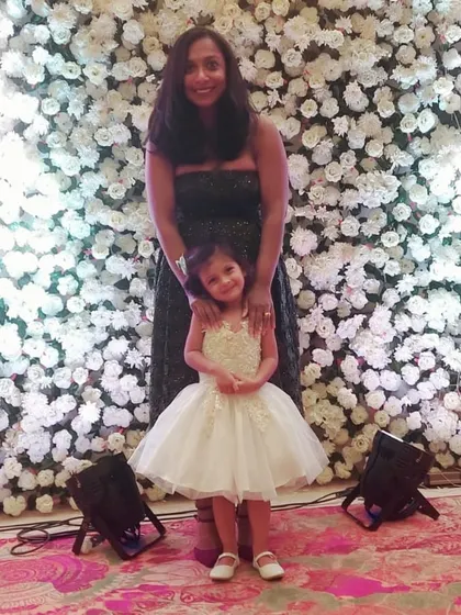 Creating beautiful memories at a wedding in this stunning white tulle dress. The intricate bodice and full, layered skirt make any little girl feel like the belle of the ball.