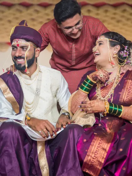 A moment of shared laughter with a friend during the wedding ceremony, showing the importance of candidly capturing friends and family.