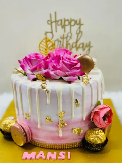 Another view of the rosy pink drip cake, perfect for a sweet and stylish birthday.