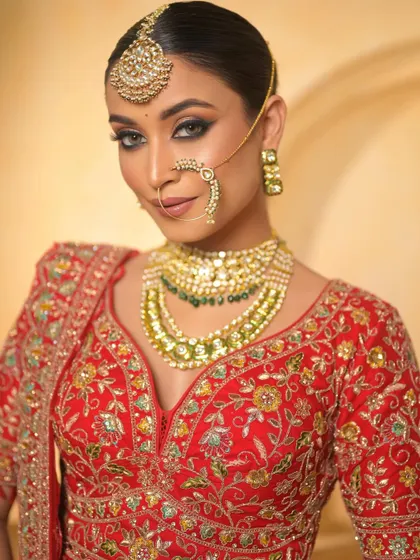 A close-up of the bride's face, showing the intricate details of the eye makeup. The smokey liner and blended shadows create a look of deep, mesmerizing beauty.