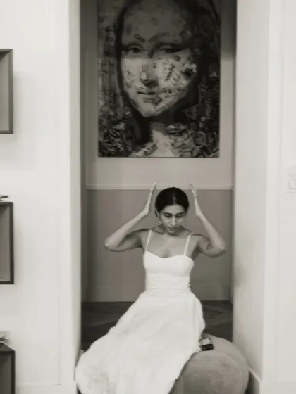 A more artistic shot from the same series, framed by a doorway with a modern art piece in the background.