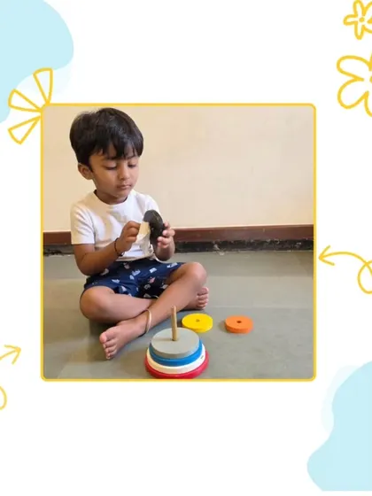 The ring stacker is a fundamental tool for developing hand eye coordination and size discrimination. As this child carefully places each ring, he is learning about order, sequence, and problem solving in a self-correcting way.