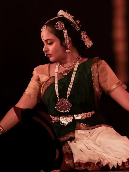 A close up of a dancer in a moment of quiet grace.