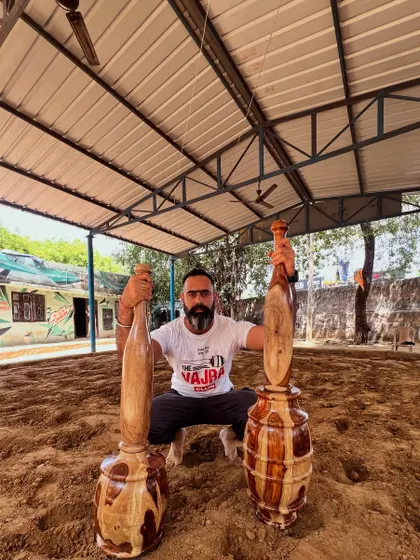 Our founder, Rishabh Malhotra, in his element at a traditional akhada. This image embodies our mission: to honor the roots of Indian strength training, connecting with the humility, discipline, and power of the soil.