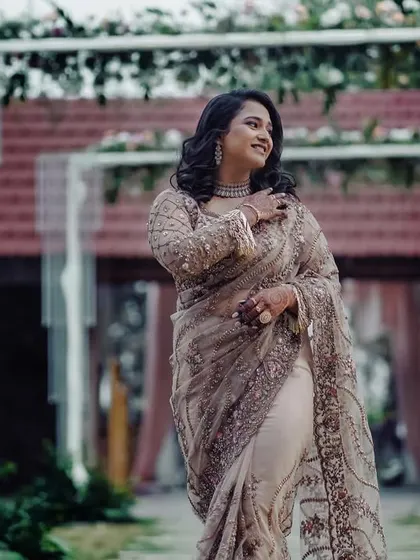A beautiful shot of Ashwitha at her outdoor reception. The makeup was designed to look flawless in both natural evening light and under event lighting.