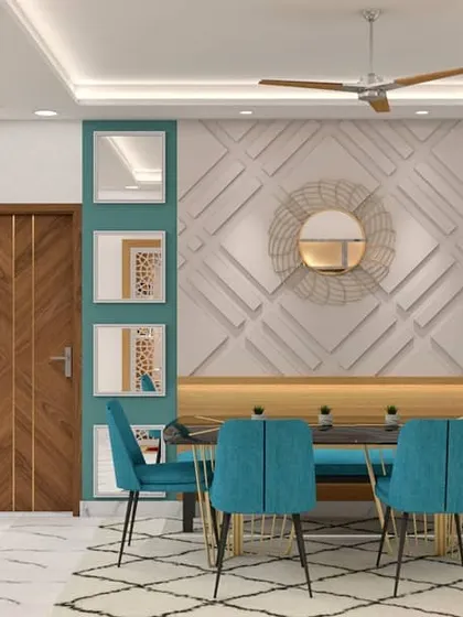 A bold dining space designed with a teal accent wall featuring 3D molding and integrated mirrors. The bench seating and vibrant blue chairs make this a stylish and unique area for family gatherings.