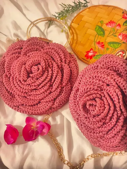 A beautiful flat lay of two dusty pink Rose Bags. One features the classic metal ring handles, while the other has a simple gold chain for a different look.