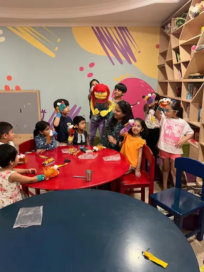A happy group shot with all their new puppet friends. This is the beginning of a week of storytelling, creativity, and performance.