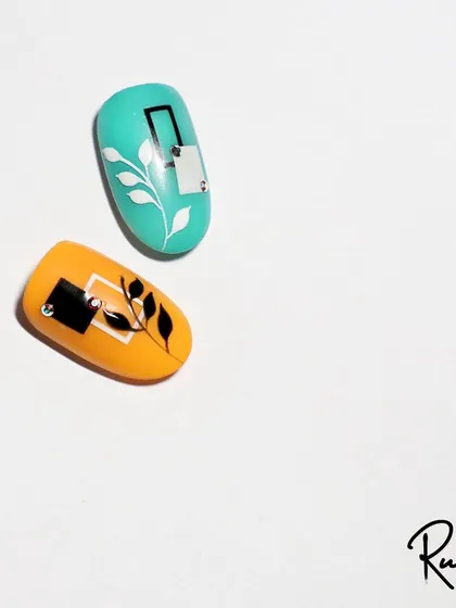 A simple and modern leaf design, accented with a single crystal. This is a great example of minimalist nail art.