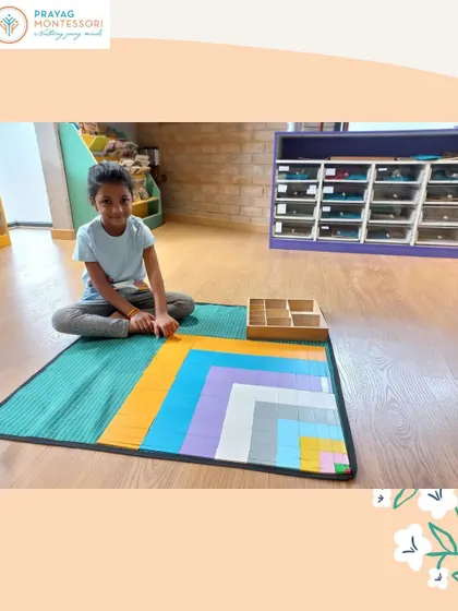 This child is deeply focused on constructing the Decanomial Square, a key material in our primary mathematics curriculum.