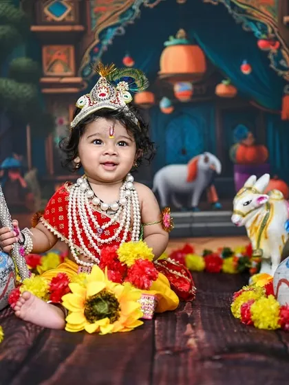 This little one dressed as Krishna is one of my most requested photoshoots. I love how the vibrant colours, detailed props, and the baby's joyful expression come together to create such a special portrait for Janmashtami.