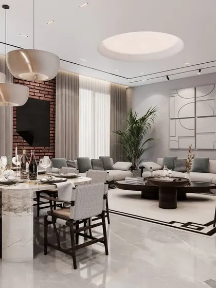 An alternative view of the living and dining space, featuring a large sectional sofa, a marble dining table, and contemporary art. The design focuses on creating a harmonious and balanced open-plan layout.