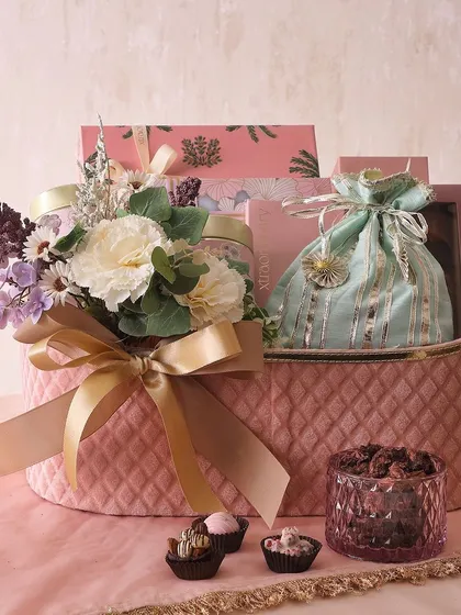 The Twinkling Star Hamper is one of our most luxurious offerings, filled with a tea cake, chocolate bar, cookies, nuts, brownies, mithai, and assorted chocolates.