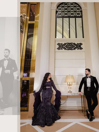A stylish, full-length portrait of the couple in a grand hotel lobby. The architecture and lighting create a sophisticated and elegant backdrop for their engagement photo.