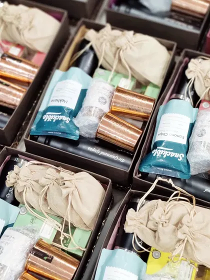 Gifting is an art, and I am awesome at curating gifts. This image shows a bulk order of hampers being prepared for one of my esteemed clients.