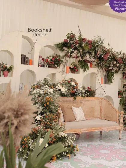 It's the personal details that tell your story. This bohemian-themed bookshelf backdrop was designed for a couple who are avid readers. I believe in decor that reflects who you are, not just a trend.