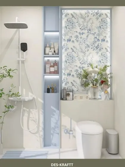Another view of the shower area, highlighting the beautiful floral panel and the practical, built-in niche for toiletries.