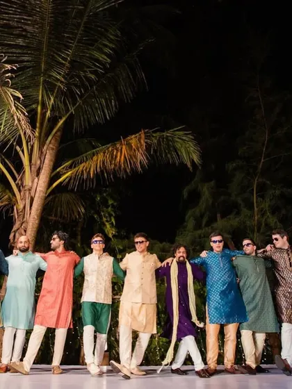 The groom's squad poses in their 'Kala Chashma' sunglasses, looking cool and ready to perform at a Goa wedding.
