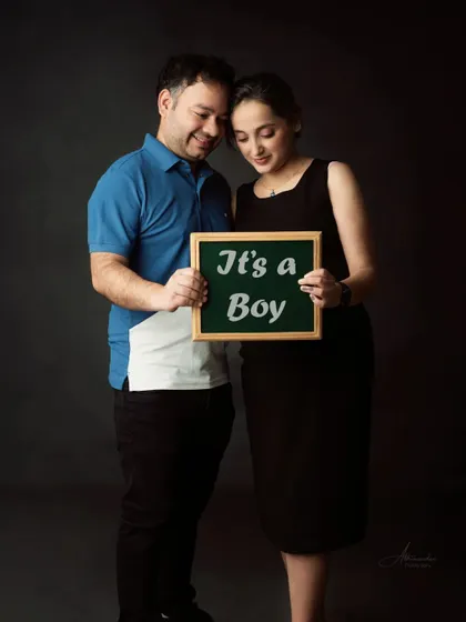 A classic "It's a Boy" announcement. The couple's happy expressions show their excitement for their new arrival.