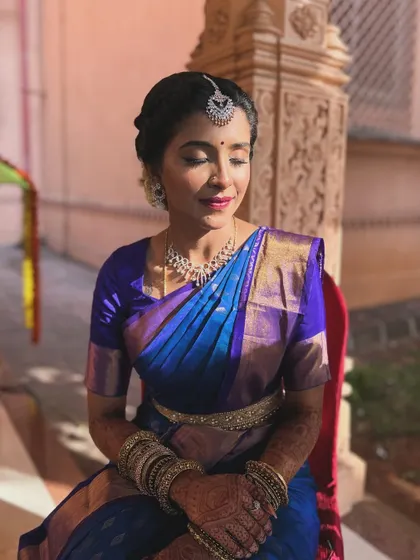 The golden hour glow on our South Indian bride. The soft, warm light enhances her dewy makeup, creating a truly magical and unfiltered look.