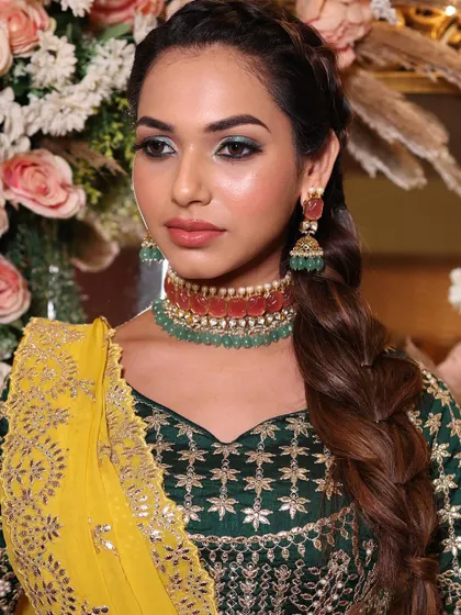 This shot highlights the beautiful contrast between the green and red in the jewelry and the green eyeshadow.