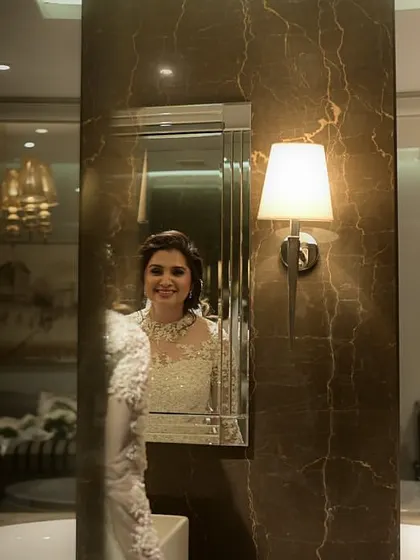 A happy smile in the mirror before heading to the ceremony.