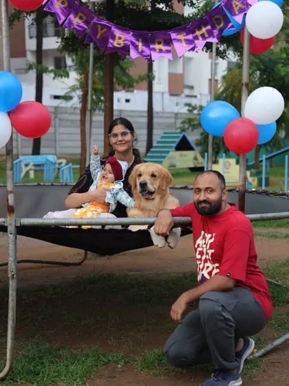The whole family, including the youngest human member, joins in for a birthday photo on the trampoline. Our events are safe and fun for kids and dogs alike.