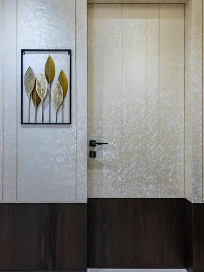 The passage and door design of this Mumbai home redefines sophistication. With seamless detailing and a focus on aesthetics, the space connects rooms while adding a sense of grandeur and harmonious flow.