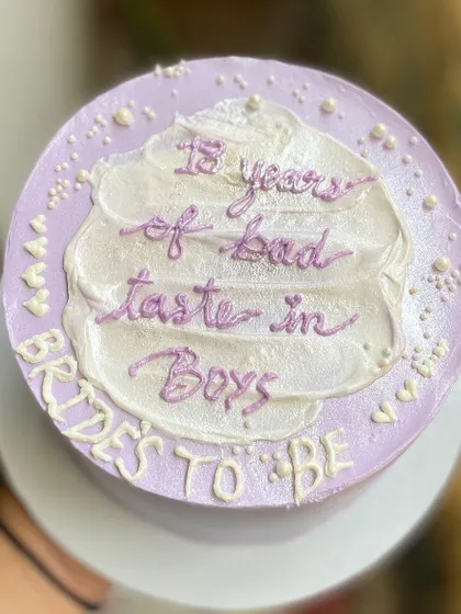 A bento cake for a bride-to-be with a sense of humour. This chocolate truffle cake reads "13 years of bad taste in Boys" and is perfect for a bachelorette party.