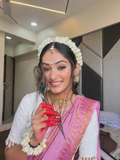 Another beautiful angle of the Radha look, showcasing the winged eyeliner and the delicate bindi art.