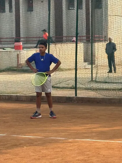 A moment of contemplation on the court. We teach our players to be thoughtful and strategic during their matches.