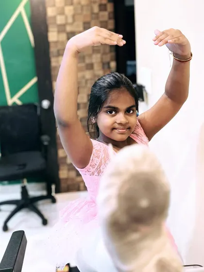 A young ballerina using a treadmill for advanced stretching exercises. I incorporate creative methods and equipment to help students safely improve their flexibility.