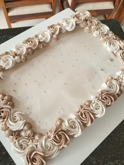 A 5.5 kg rectangular cake for a corporate event, with detailed floral piping.
