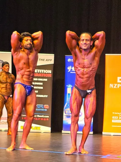 An abs and thigh pose on the world stage. Every muscle detail counts in a competition.