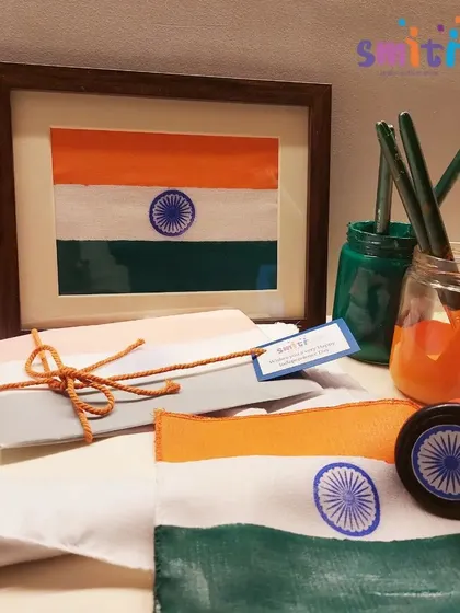 The finished khadi flags, beautifully painted and framed. This activity results in a meaningful piece of art that children can take home with pride.