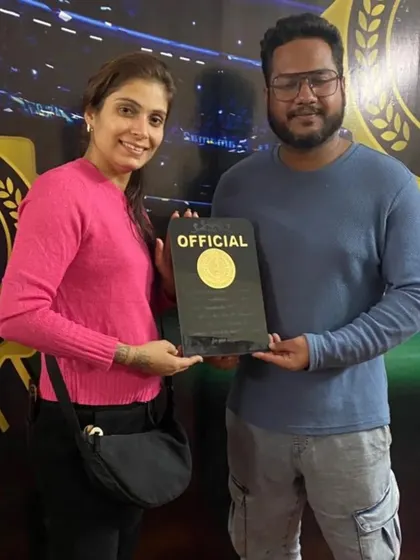 A member of our team receiving an official plaque, recognizing her contribution to the Sanshinkan Open.