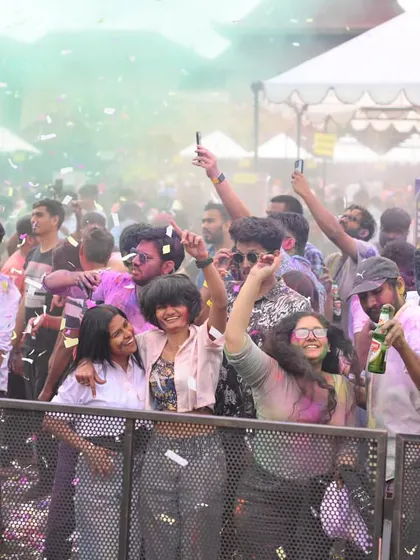 Happy faces in the crowd at the Sunburn Holi party. My goal is simple: to make people dance, smile, and have the time of their lives.
