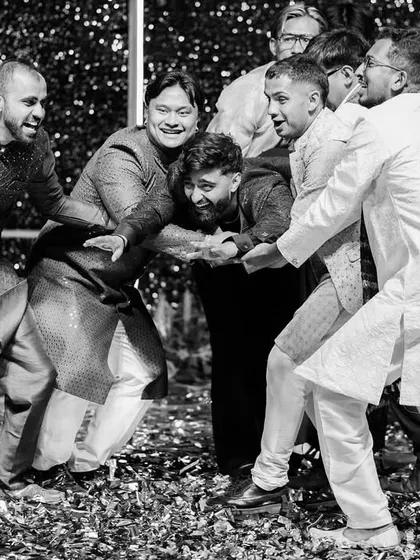 The groom being playfully mobbed by his friends on the dance floor. These chaotic, fun-filled moments are some of the most memorable.