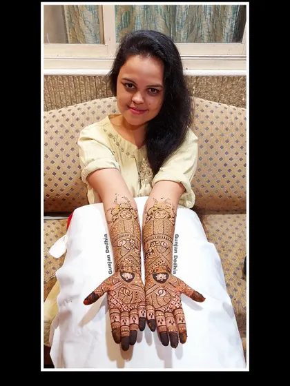 My happy client Rasika, showing off her intricate engagement mehendi. The design is a beautiful mix of traditional patterns and modern elements.