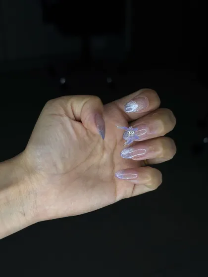 A side view of the 4D ombre nail set, showing the delicate structure of the butterfly embellishment.