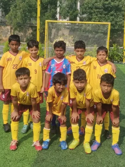 Another shot of our proud U9 team representing the colors of Karnataka.