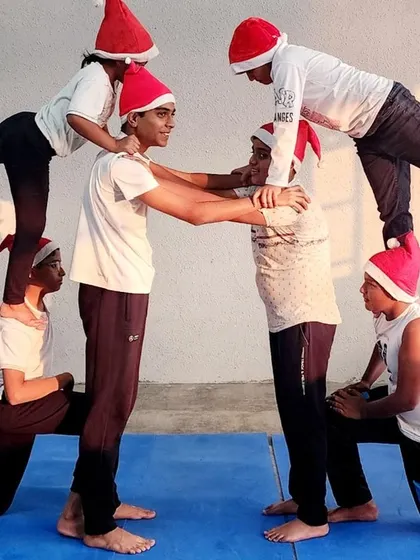 Our campers form a festive, symmetrical shape, showcasing their strength and coordination. Celebrating holidays together makes our community stronger.