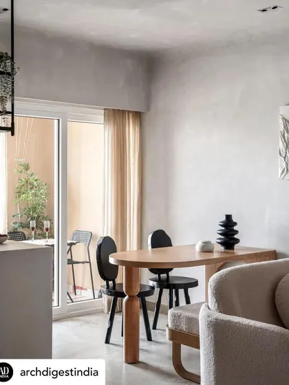 This dining area in a compact 450-square-foot apartment shows how smart design can create a functional and beautiful space. I removed walls to let in natural light and used an earthy, monotone palette to create a sense of calm.