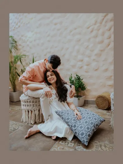 A duplicate of a tender forehead kiss, a classic romantic pose that never fails to capture the heart.