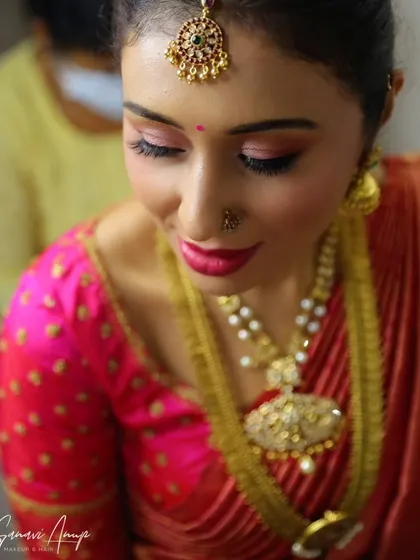 A close-up of a soft pink glam look for a muhurtham. The shimmery pink eyeshadow adds a touch of romance to the traditional attire.