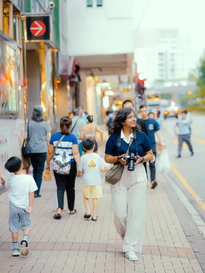 Exploring the streets of Kowloon, Hong Kong. I was so happy to be back in the city, and this candid shot captures my excitement to be out with my camera, ready to capture new stories.