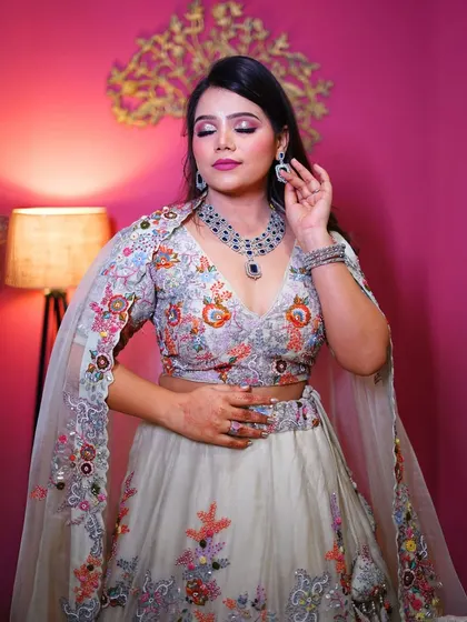 A close-up of our white floral lehenga with cape sleeves, a dreamy and ethereal choice.